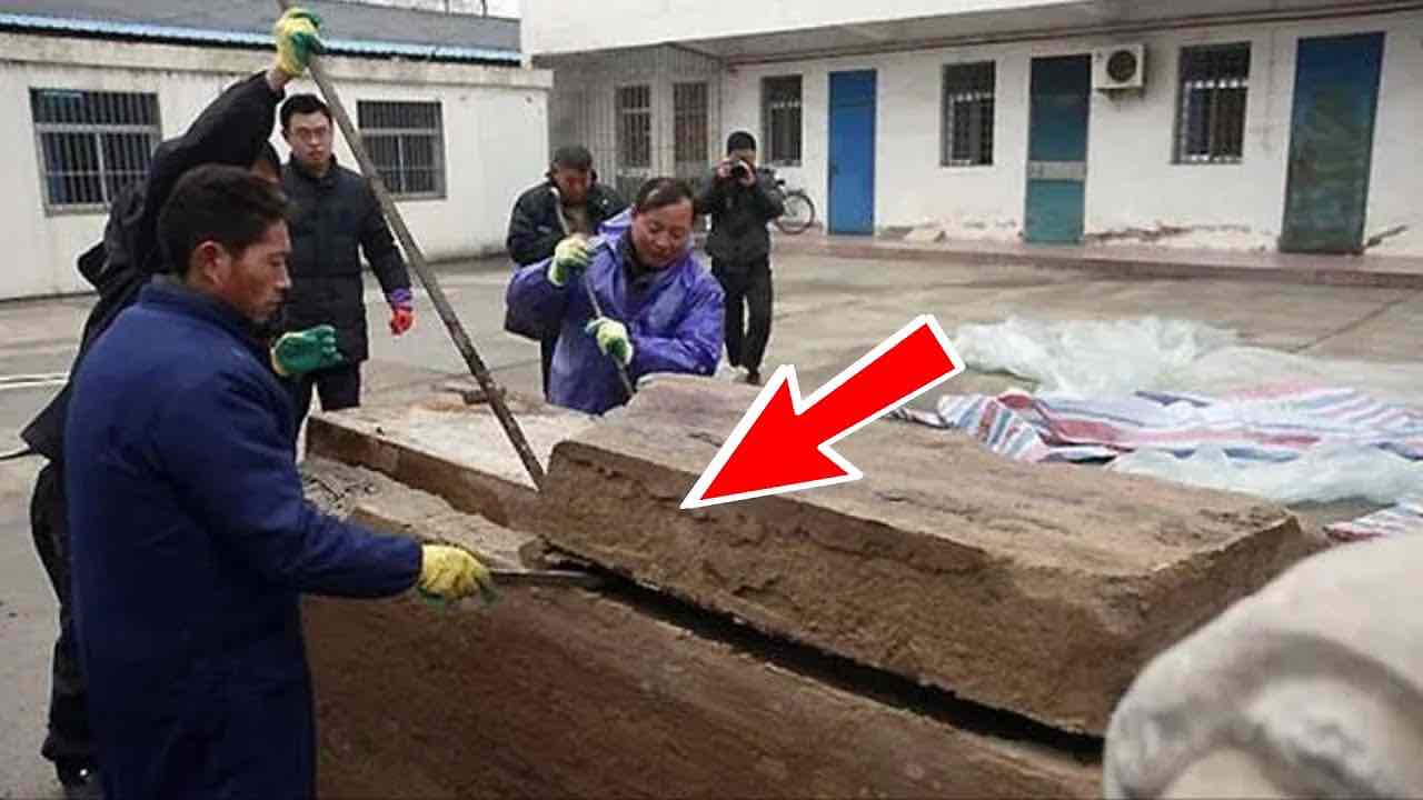 The workers come across an underground building, which they open without speaking